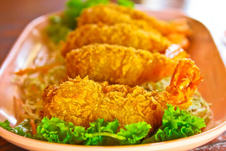 Prawns fritter cover with crisp bread and saladの写真素材