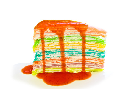 Crepe cake pour with strawberry sauceの写真素材