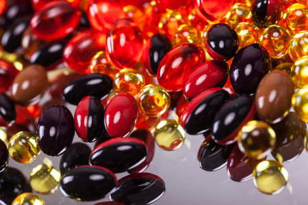 a scattering of colored capsules and tablets, close-up, photograph with depth of field