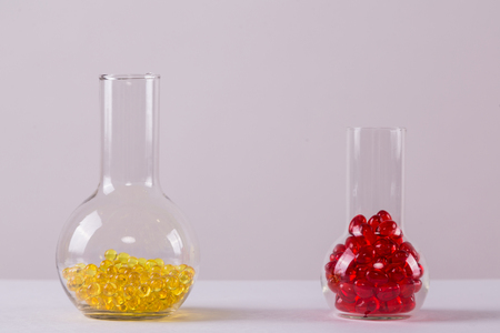 red and yellow capsule medical vitro, picture with depth of field, macroの写真素材