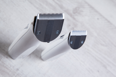 clippers barber professional tool for cutting, shot with depth of field on light textured background.の写真素材