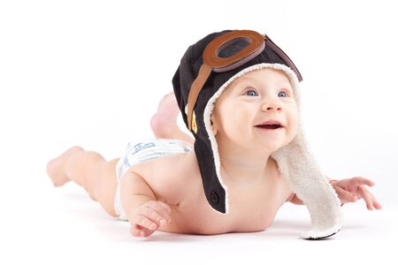 isolated on white, happy baby caucasian boy in diaper and pilot hatの写真素材