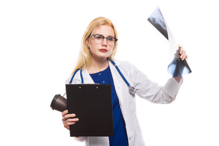 Female doctor in white coat wear stethoscope and glasses hold clipboard and coffeecup and X-ray...