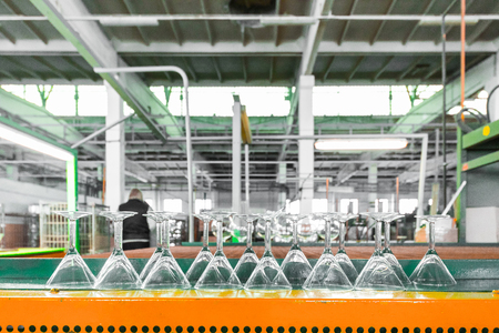 Glass producing at factory stemware in a rowの写真素材