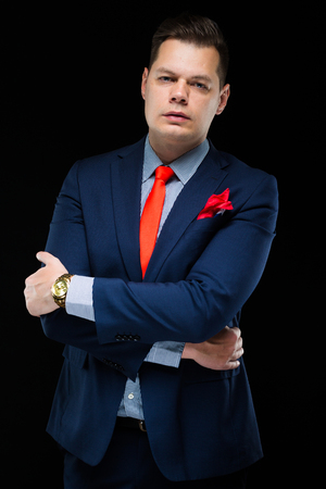 Young caucasian elegant smart business man in blue suit standing in office looking in cameraの写真素材