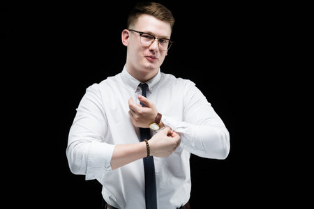 Young caucasian elegant successful smiling smart business man in white shirt standing in office...