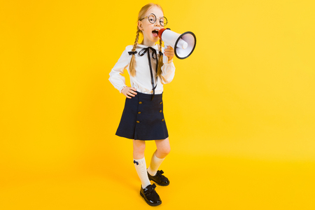 Portrait of a beautiful girl in a white blouse and black skirt.の写真素材