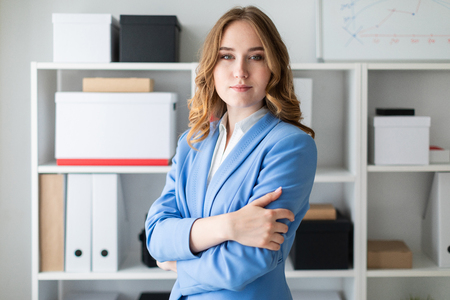 Charming young girl in a blue jacket and white blouse. photo with depth of fieldの写真素材