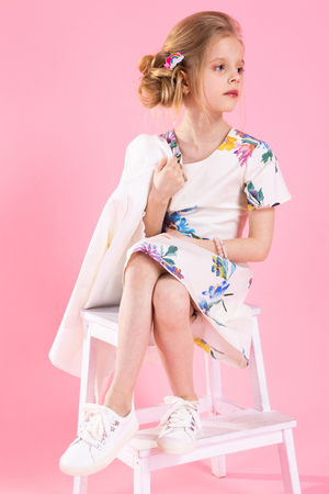 A teenage girl in light clothes, Studio photographyの写真素材