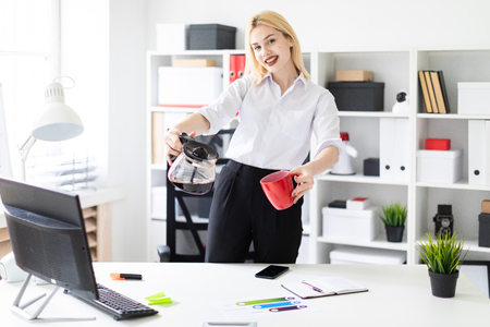Cute young girl working in a bright office. The girl has white hair and wearing glasses. Shes wearing a white shirt and black pants. photo with depth of field Cute young girl working in a bright office. The girl has white hair and wearing glasses. Shes wearing a white shirt and black pants. photo with depth of field