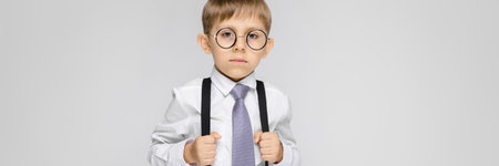 Portrait of a boy on a gray background