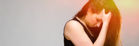 Half-length portrait of attractive frustrated disappointed young brunette caucasian girl in black...