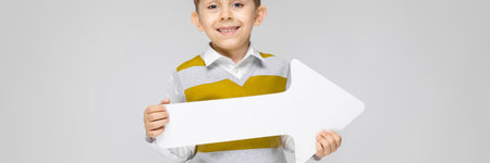 Portrait of a boy on a gray background