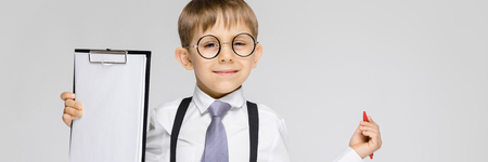 Portrait of a boy on a gray backgroundの写真素材