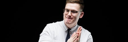 Young caucasian elegant successful smiling smart business man in white shirt and tie standing in office looking in cameraの写真素材