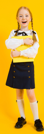 Portrait of a beautiful girl in a white blouse and black skirt.の写真素材