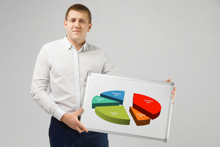 Confidence and business concept. close-up Portrait of successful young entrepreneur standing in shirt isolated in the Studio on white background and holding a magnetic Board. place for a labelの写真素材