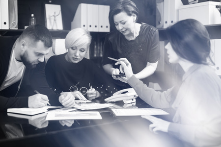 group of successful businessmen.Business group discussion concept. Colleagues exchange ideas at an office meeting. Black and white imageの写真素材