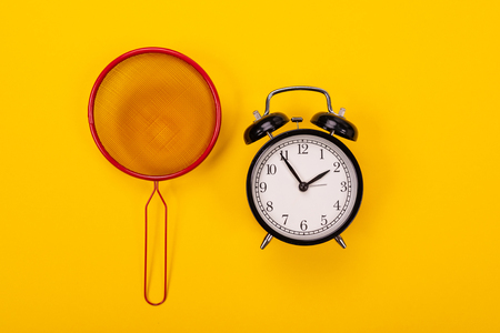 Composition of kitchen utensils for cooking isolated on colorful yellow backgroundの写真素材