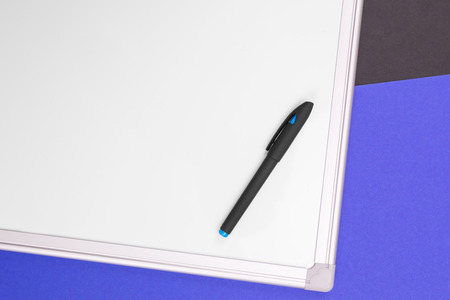 Top view of work place with modern accounting supplies isolated on blue black backgroundの写真素材