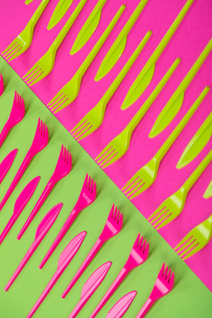 Composition of colorful kitchen cutlery on a bright background top viewの写真素材