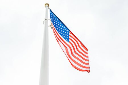 flag of the United States in the skyの写真素材