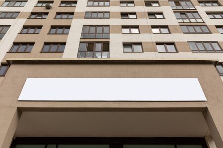 Ground view of straight luxury apartment facade with copyspace.