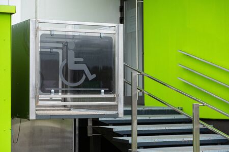 Entrance to apartment building with elevator for wheelchairers