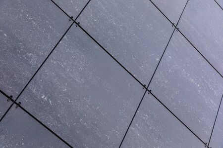 Diagonal view of smooth ceramics on wall, exterior and interior design.
