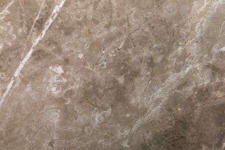 Beige or soft brown abstract texture backdrop with marble stone pattern for kitchen or bathroom countertop or exterior design.の写真素材