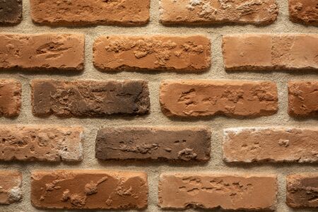 Close-up of brown and beige bared brick wall