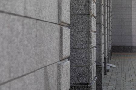 Grey granite tile wall of empty corridorの写真素材