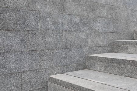 A fragment of stone tile wall and steps in city of Minskの写真素材
