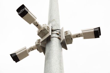 Bottom view of three white safety camerasの写真素材