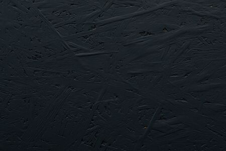 An unsmooth black painted cork construction material backgroundの写真素材