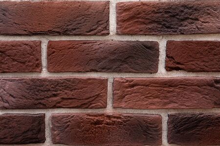 close-up of a reddish antique brickwork front panel.