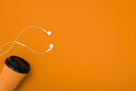 minimalism concept. paper cup on a orange background with copy space.の写真素材
