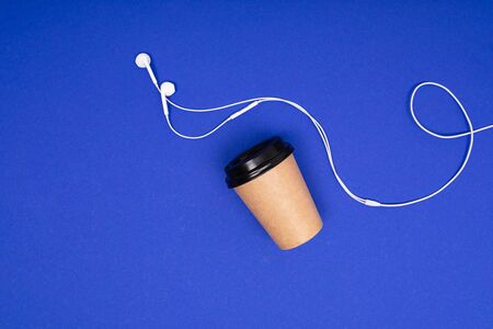 minimalism concept. paper cup on a blue background with copy spaceの写真素材