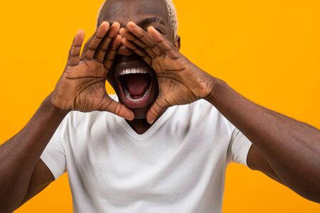 young black african man screaming.の写真素材