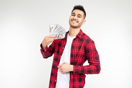 a man in a plaid shirt reports winning money in a casino on a white background with copy space.