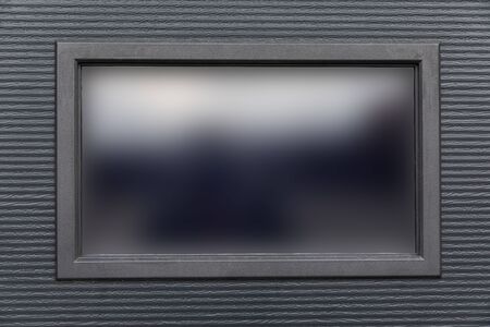 Big window in black wall.