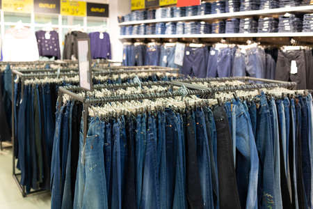 clothing store with a wide selection of trousers.の写真素材