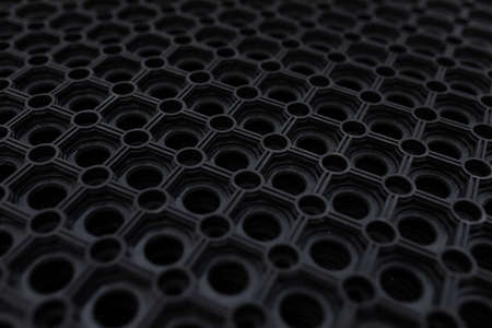 black rubber floor mat close-up.