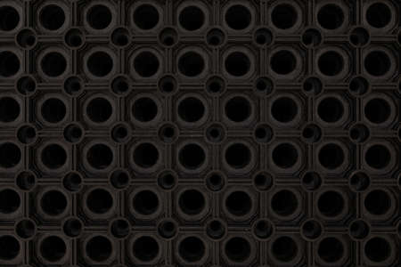 black rubber floor mat close-up.
