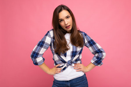 Photo shot of cute nice charming gorgeous attractive pretty youngster woman wearing stylish clothes isolated over colorful background with copy space.の写真素材