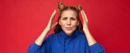 Panoramic closeup photo of beautiful attractive angry shocked amazed surprised young woman with open mouth wearing casual clothes isolated over colourful background with empty space.の写真素材