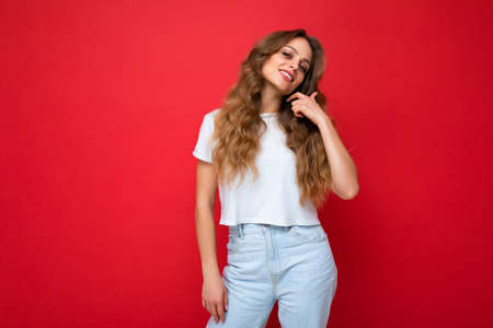 Portrait of young beautiful smiling hipster woman in trendy outfit. Sexy carefree female person...