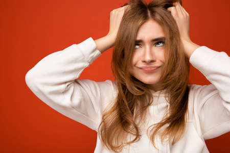 Photo of emotional sat adult beautiful dark blonde woman with sincere emotions isolated on...