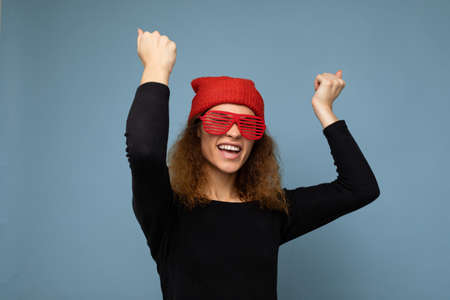 Photo shot of beautiful happy smiling young dark blonde woman wearing casual clothes red bandana and...