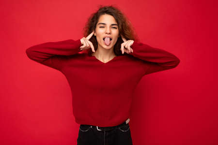 Photo of young positive happy attractive brunette wavy-haired woman with sincere emotions wearing...